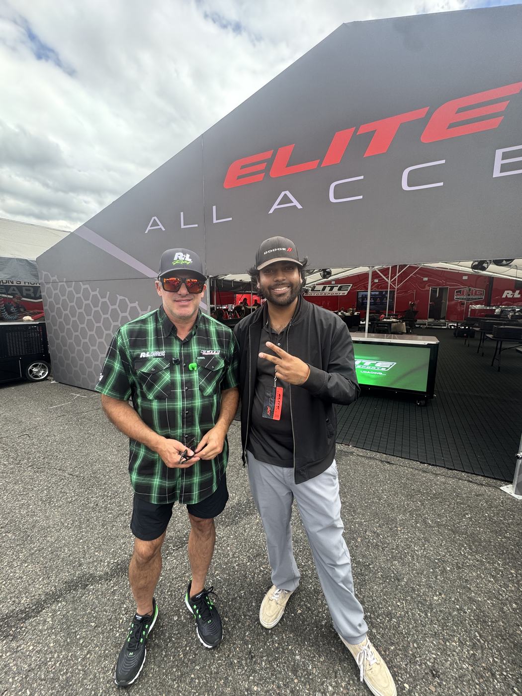 Lucky Ranasinghe, Creator and Owner of MADITECH and JOEY, with Tony Stewart outside the Elite All Access hospitality structure at Pacific Raceways