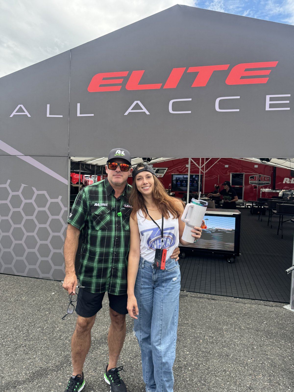Brooke Ives, CTO of JOEY, with Tony Stewart in front of the Elite All Access tent